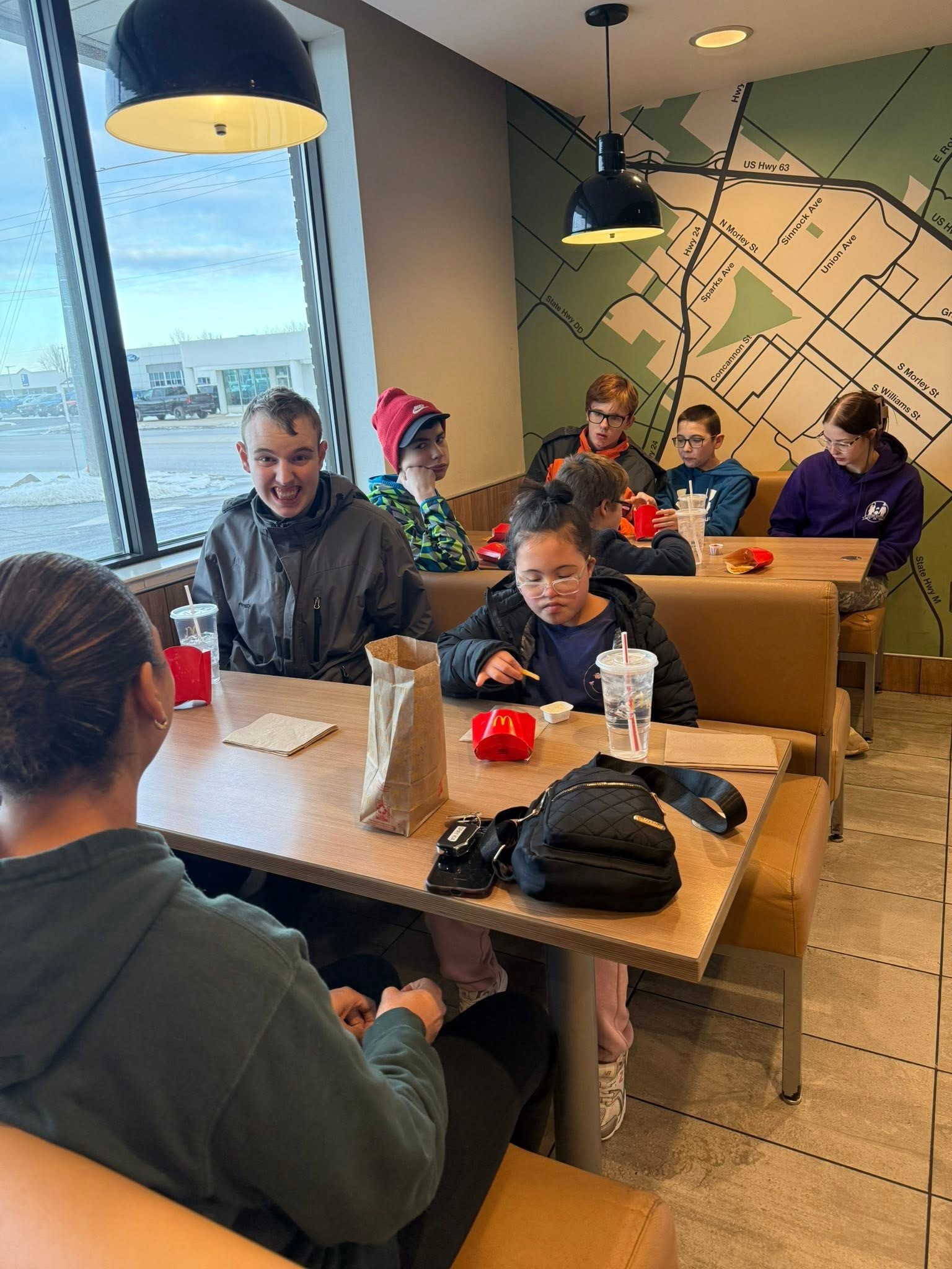 Discovery Program participants enjoying a community outing to McDonald's in Moberly, building social and life skills
