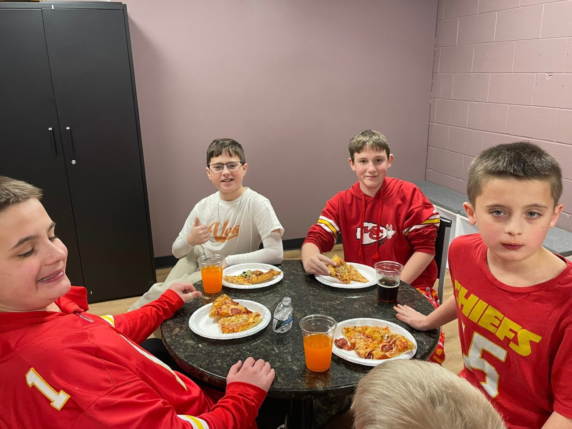 Discovery Program participants sharing pizza together, building friendships and social connections